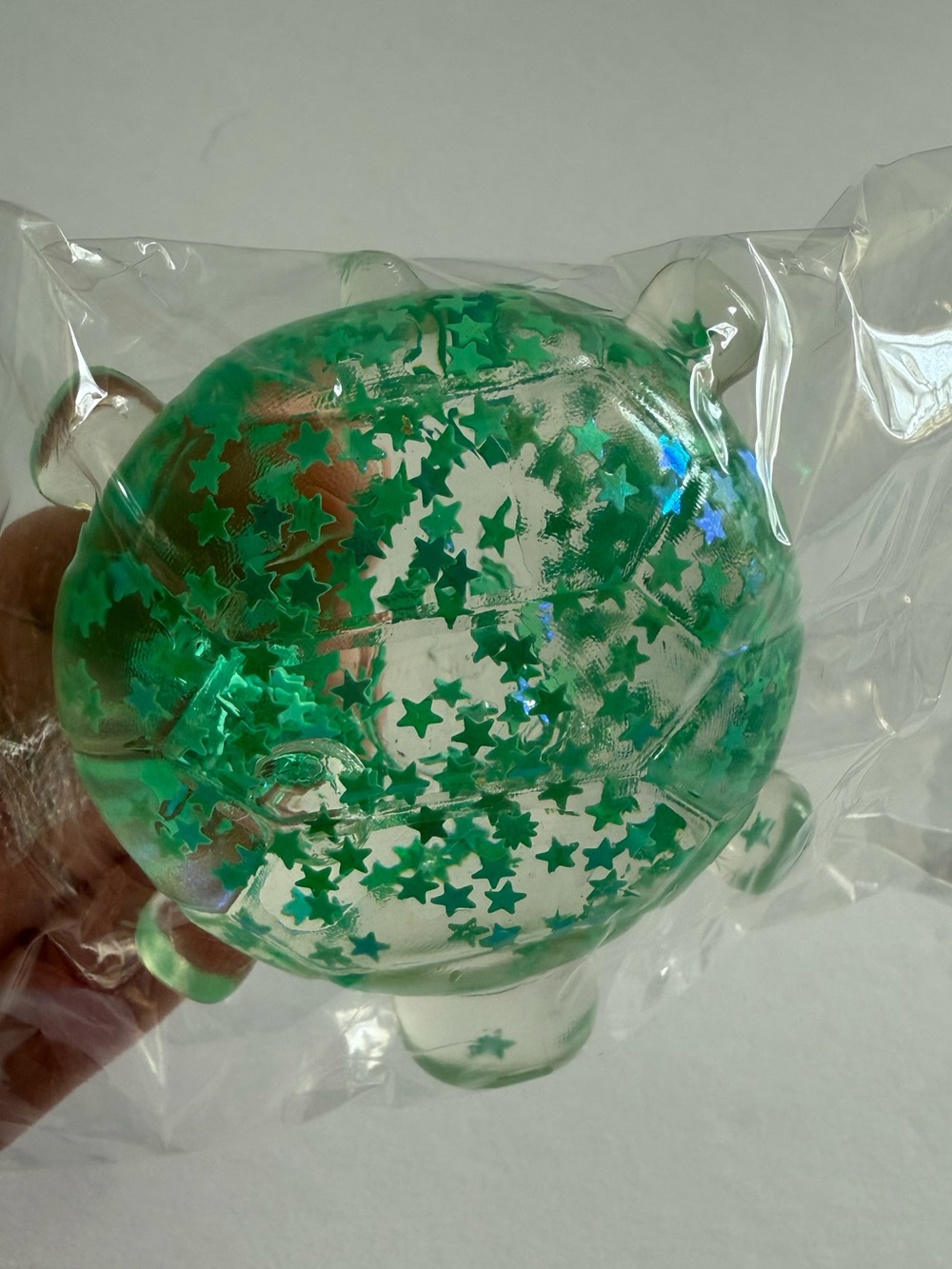 Clear Turtle squishy with green Star Glitter